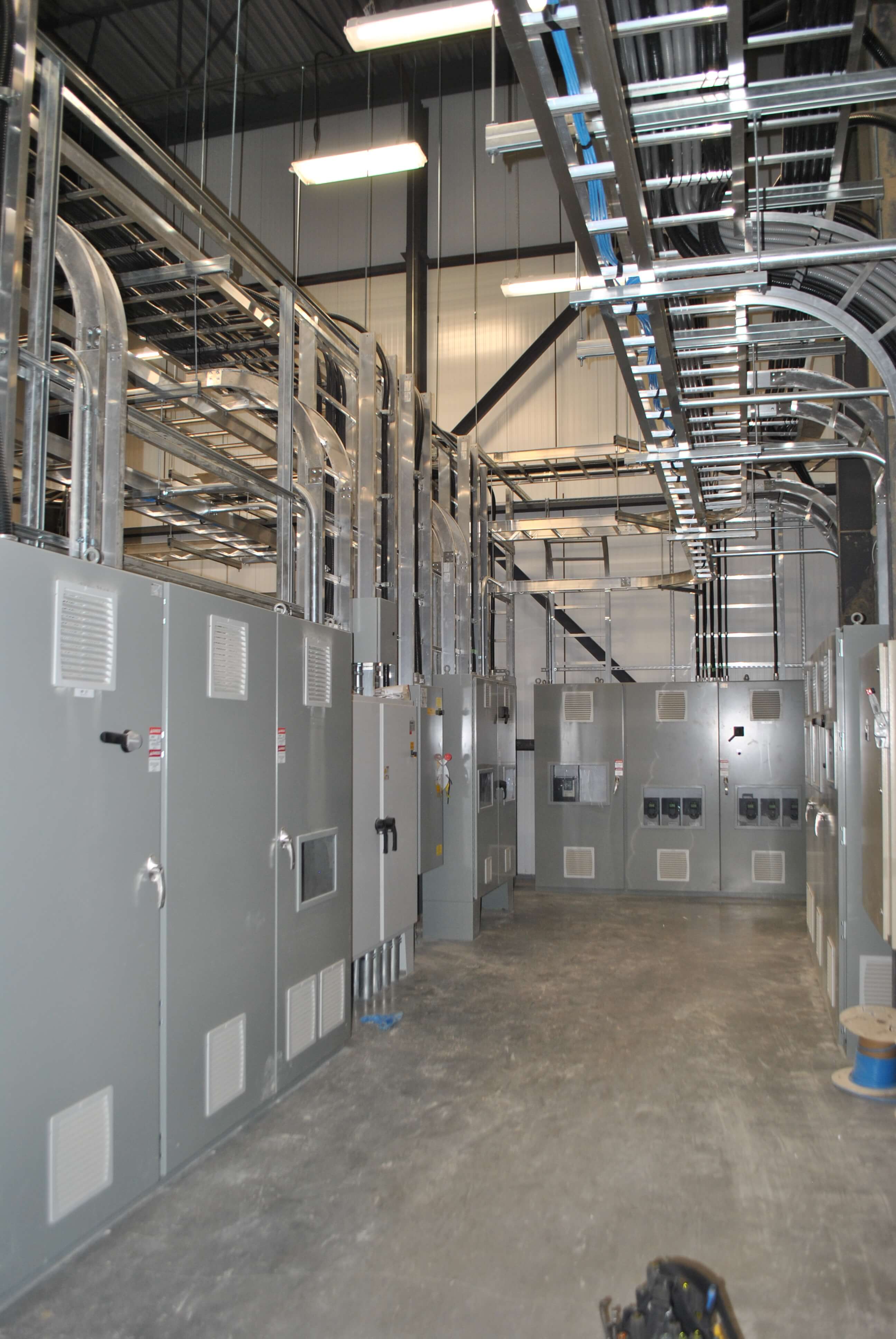 engineer working-checking-maintenance-equipment-wiring-plc-cabinet